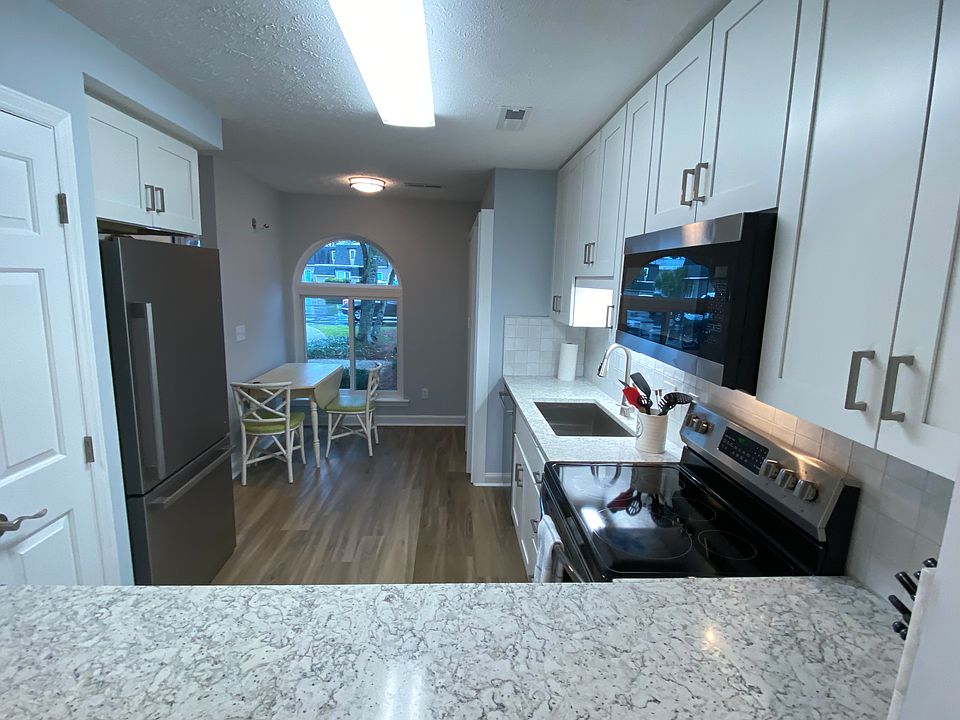 New kitchen installed in March 2026. New quartz countertops with bar accessible to living space.