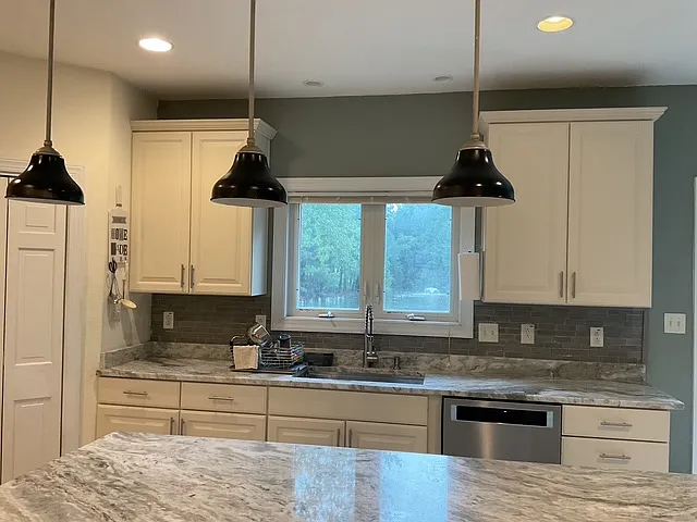 Kitchen Island overlooking sink and backyard