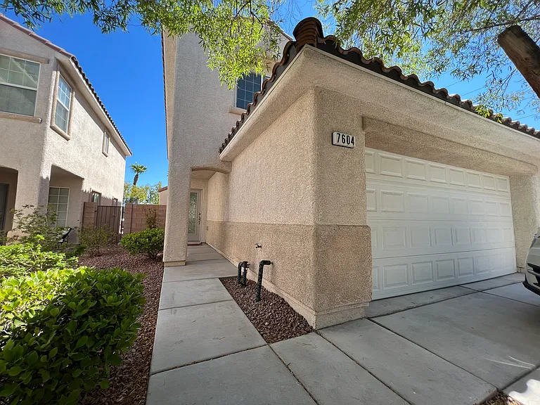 Shaded walkway along the side to the front door entrance.