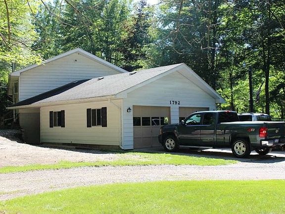 Large garage is 28x24 plus 24x40 pole barn. A new septic tank and field were added in 2015.