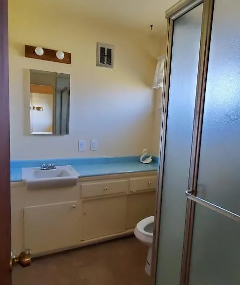 Bath behind Kitchen