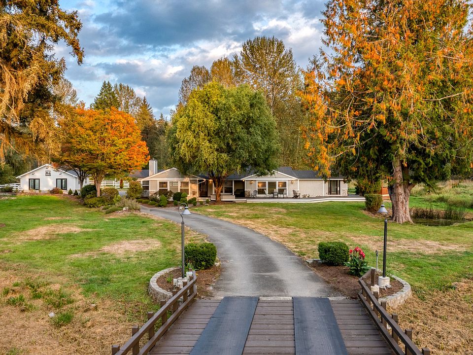 Peaceful one of a kind property on 5.5 acres with a creek, pond, hot tub, fire pit, wedding barn, BBQ, and centrally located!