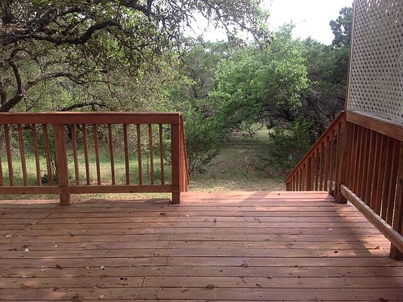 BACK SIDE OF DECK LEADING TO BACKYARD
