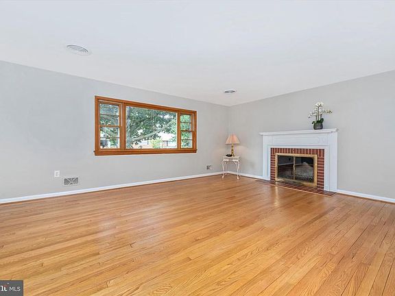 Living Room has wood burning fireplace.