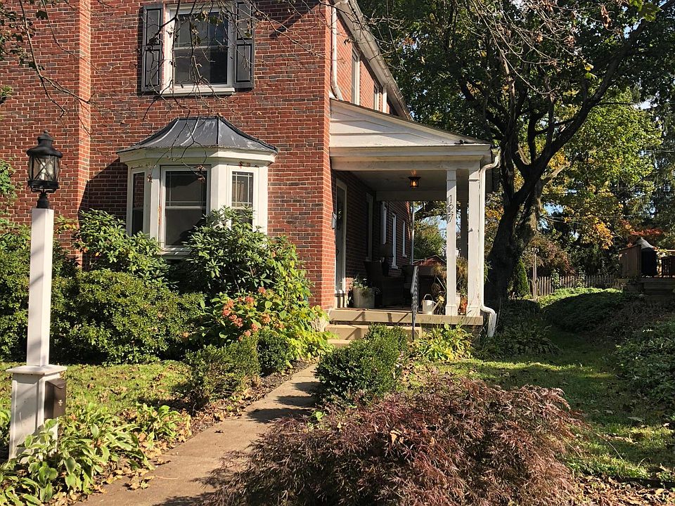 Front, mature landscaping