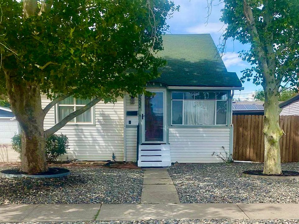 Front of home. Mature sycamore shade trees. Newly xeriscaped front yard.
