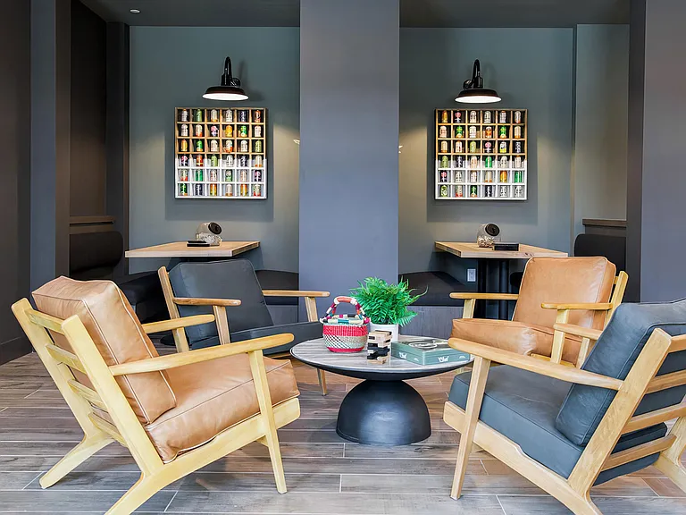 Indoor social area with comfy seating and private booths