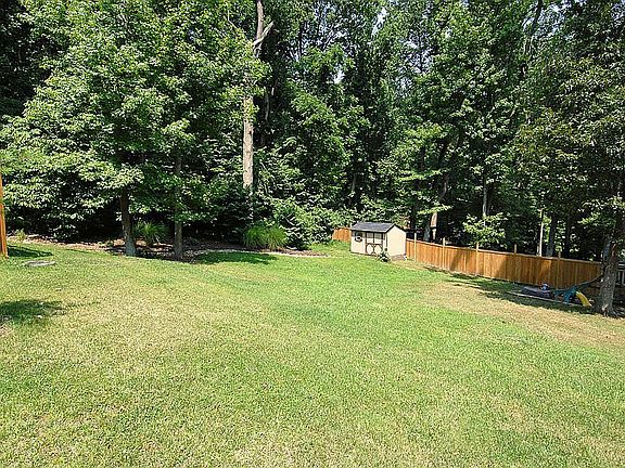 Large, partially fenced yard