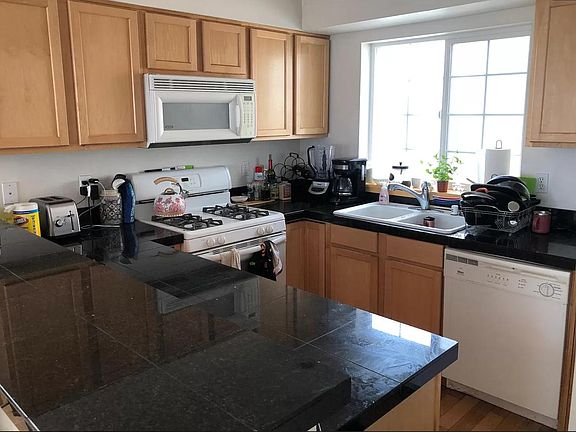 kitchen with gas stove, large sink, and lots of cabinet space