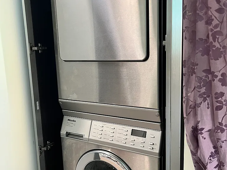 washer and dryer in master bedroom hall