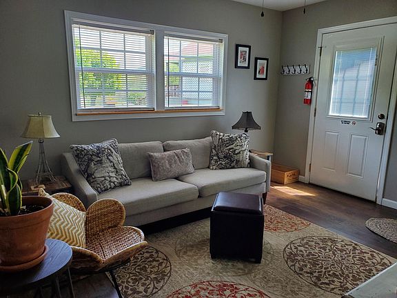 Living room as seen from bathroom doorway.