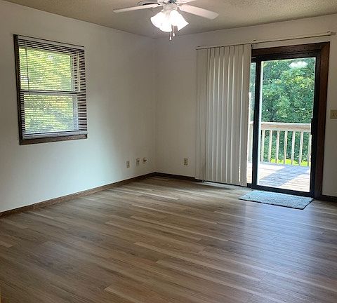 Living room with balcony deck access