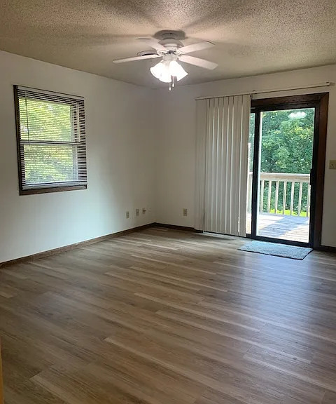 Living room with balcony deck access
