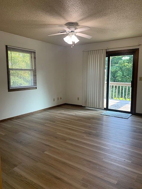 Living room with balcony deck access