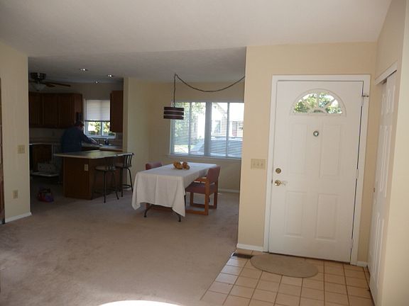 Tiled entrance and 11'x11' dining area
