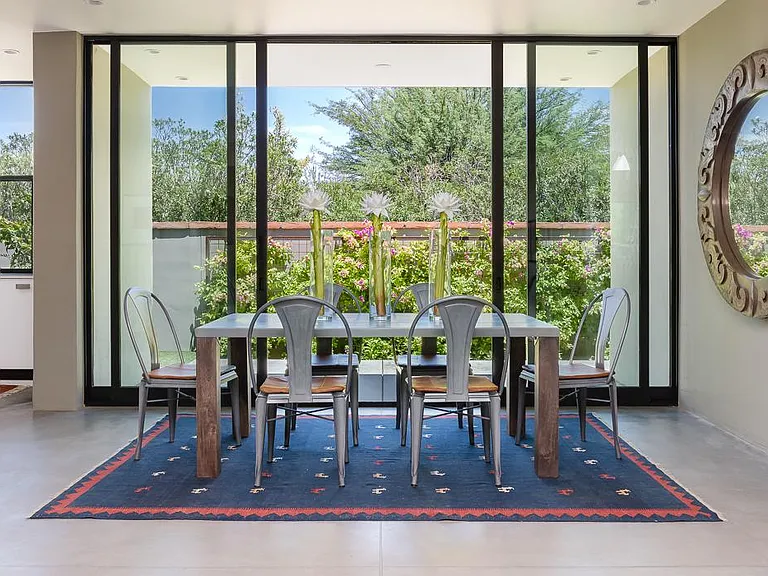 Dining area with massive sliding doors to give indoor/outdoor experience