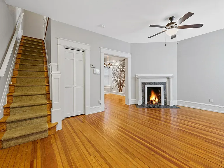 Living room with view into the dining room. Look at those floors!