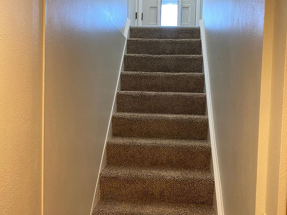 Stairs leading up to apt entry (entry is patio door shown in Photo 11; optional entry is thru garage door)
