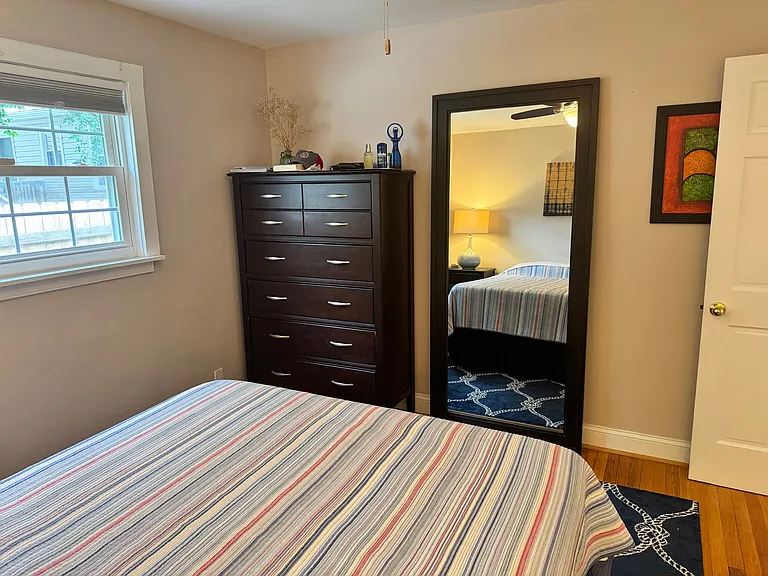 Bedroom 1 of 2 with large dresser and mirror for looking good at the beach!