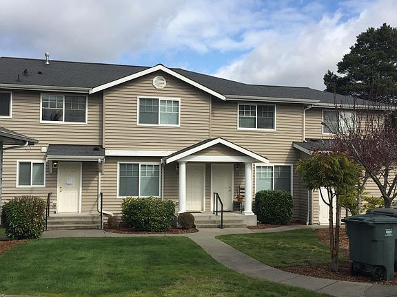 Front door on side of building with easy access to garage an