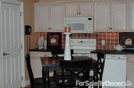 Kitchen
						:
						Marble tiled backsplash, hardwood floor, lighting under cab., applicances inc.