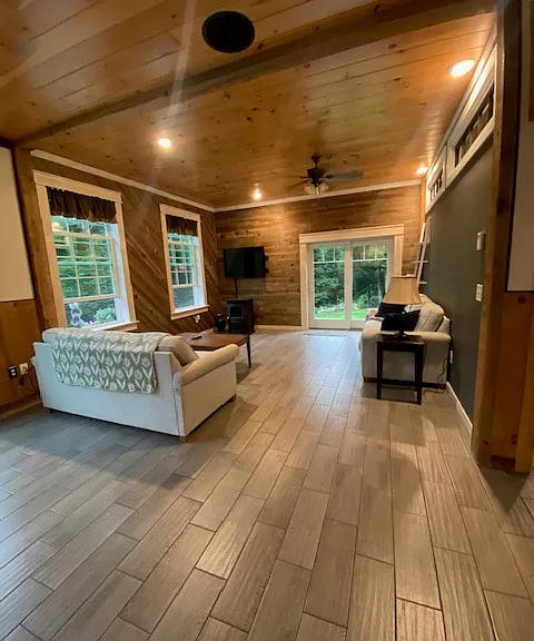 Photo of open floor plan of family / living area as seen from kitchen.