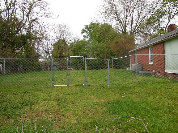 huge fenced in side & back yard