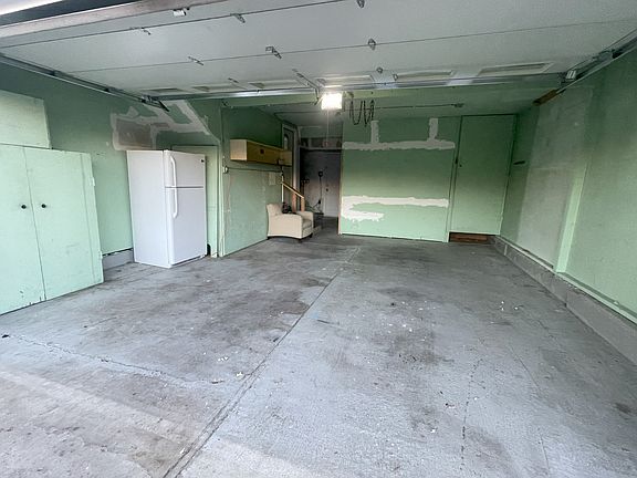 Indoor garage parking and a workshop off the back of the garage. Private entry and lots of storage