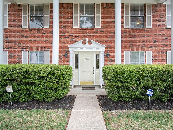 Newly painted front door, kick plate and pressure washed walkway.