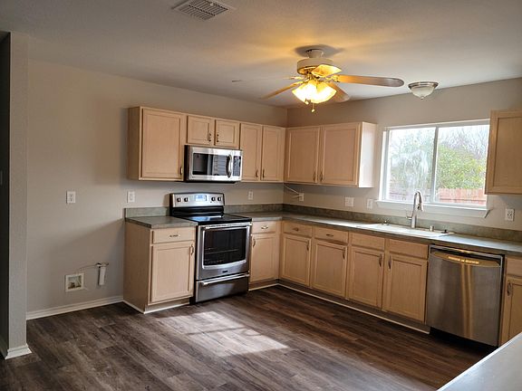Large kitchen with stainless steel appliances