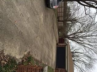 HUGE concrete driveway with additional parking for toys