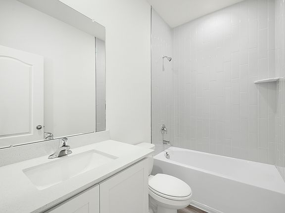 The secondary bathroom with a shower tub combo