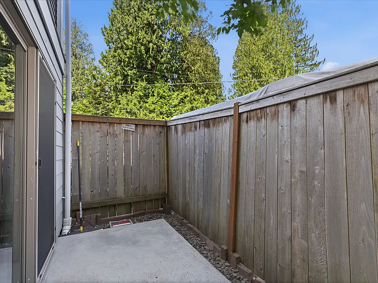 Outdoor patio area offering a useful extension of the lower-level living space.