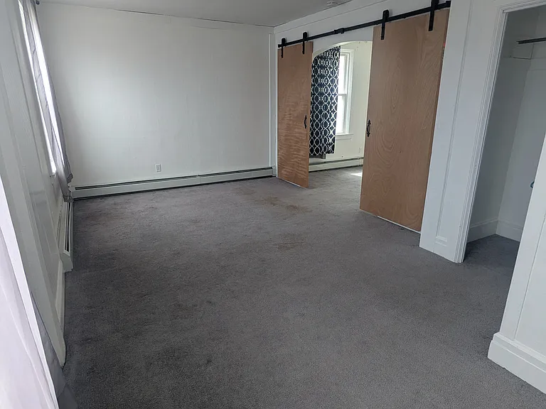 large bedroom or living space off of entry room