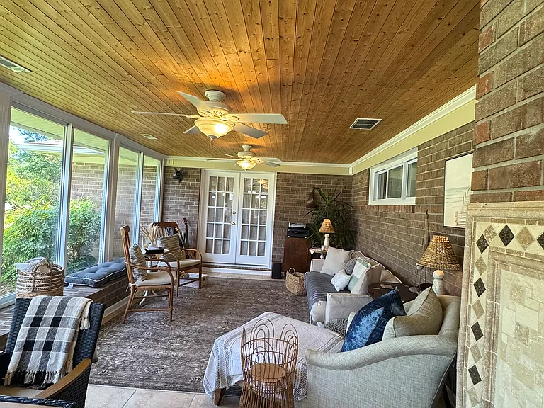 Spacious Sunroom with sets of French doors leading to the patio, family room, or master bedroom.