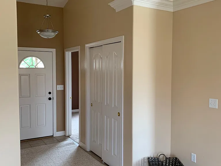Enter through light, airy entrance with vaulted ceilings.