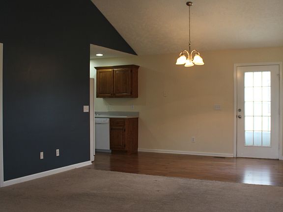 Open floor plan with eat in kitchen and single french door l