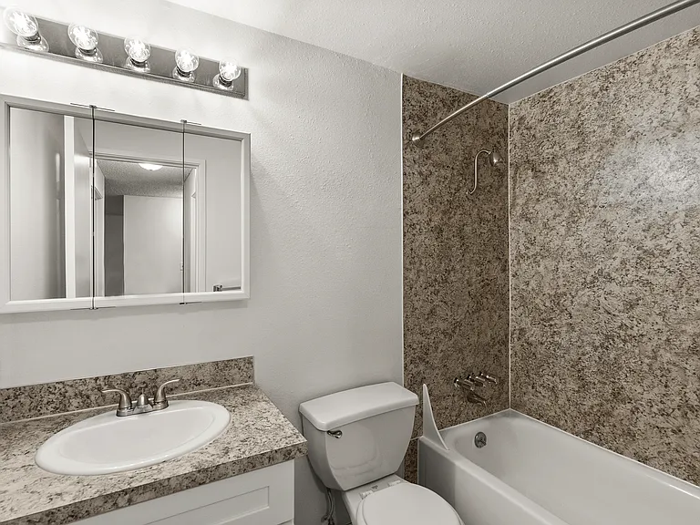 Start and end your day in a clean, modern bathroom featuring stylish finishes, ample mirror space, and a full bathtub and shower. Start and end your day in a clean, modern bathroom featuring stylish finishes, ample mirror space, and a full bathtub and sho