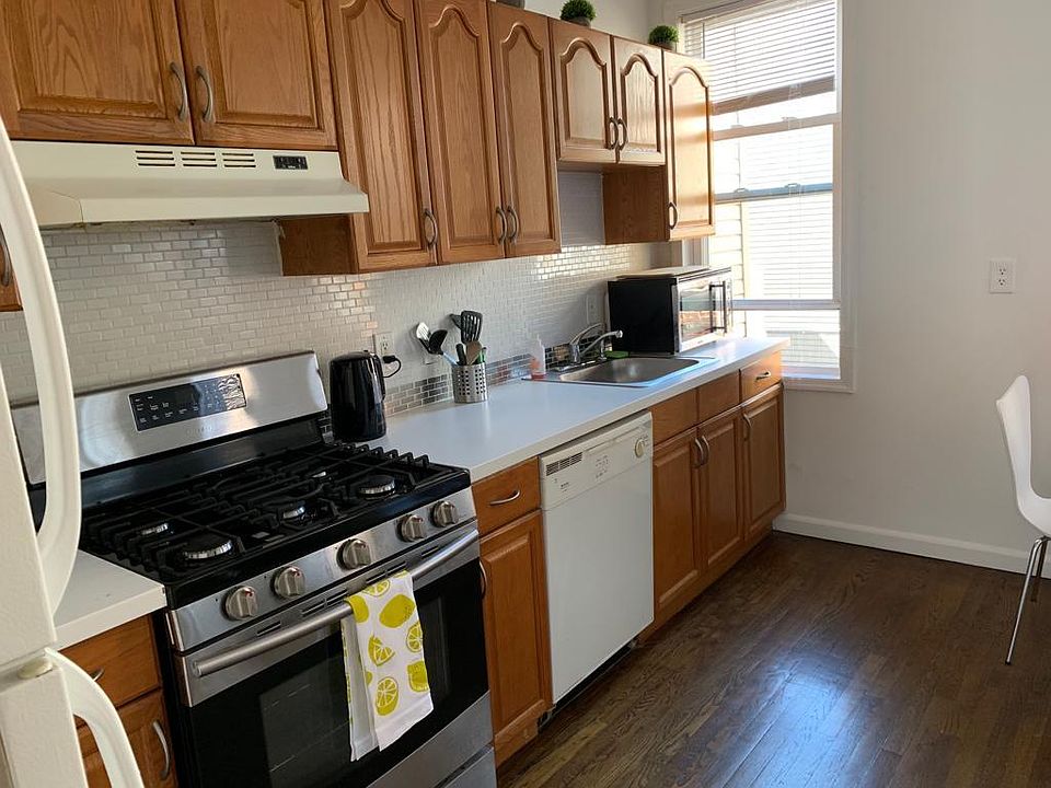 The apartment has an updated kitchen with dishwasher, fridge, freezer, microwave, and oven.
