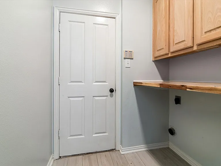 Separate utility room for a full size washer and dryer