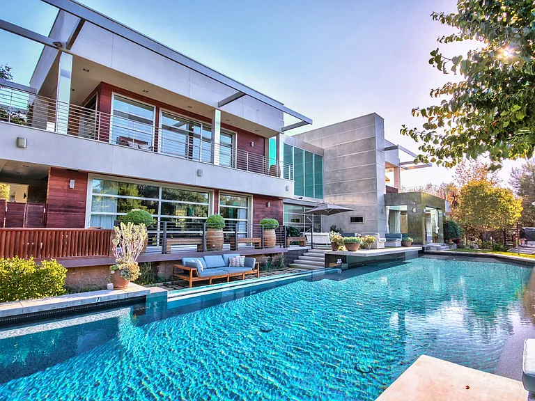 swimming pool 20'wide X 80" long goes to 9 feet deep seating are around inside of pool solar heated