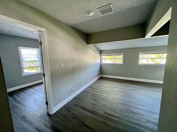 living room and entry to first bedroom