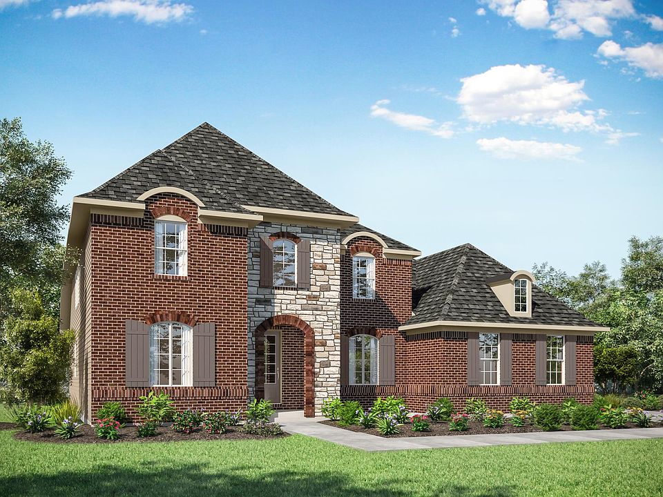 custom home with brick and stone