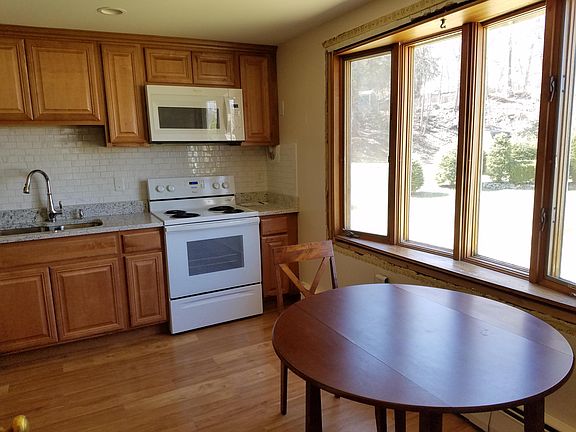 Kitchen has a large bow window.