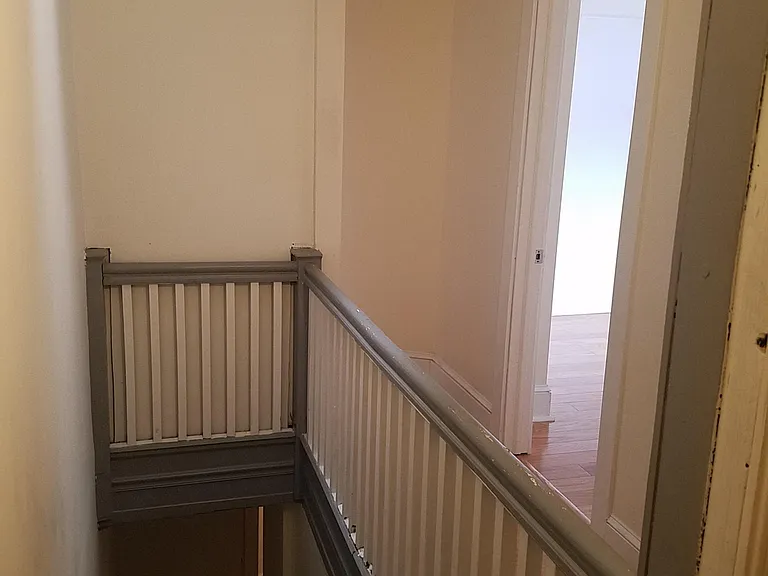 In unit stair/hall with skylight above