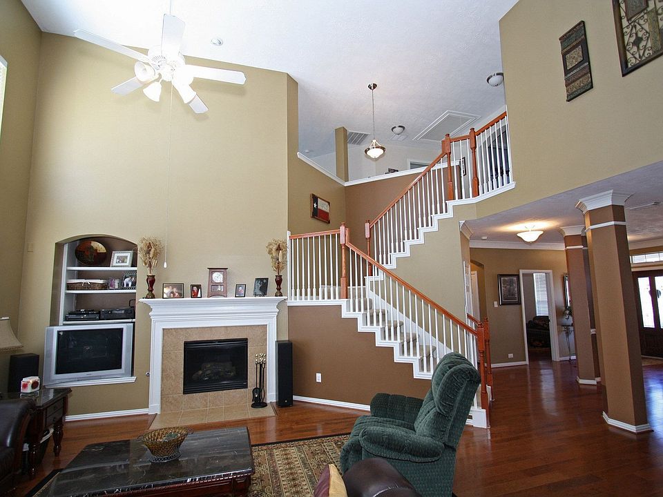 Den is open to dining, kitchen and breakfast area.