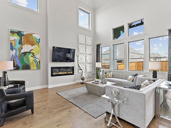 Living room in the Byron home plan by Trophy Signature Homes - REPRESENTATIVE PHOTO