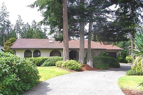 Circular driveway leads up to home
