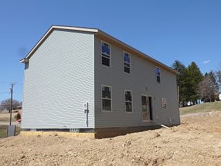 back of home prior to deck