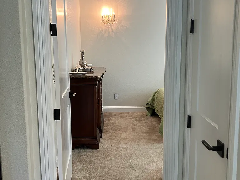 Hallway to one of the bedrooms